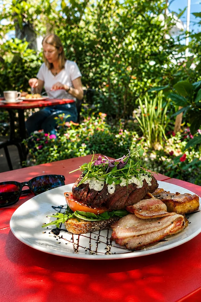 Brunch on a red garden table at Good Habit