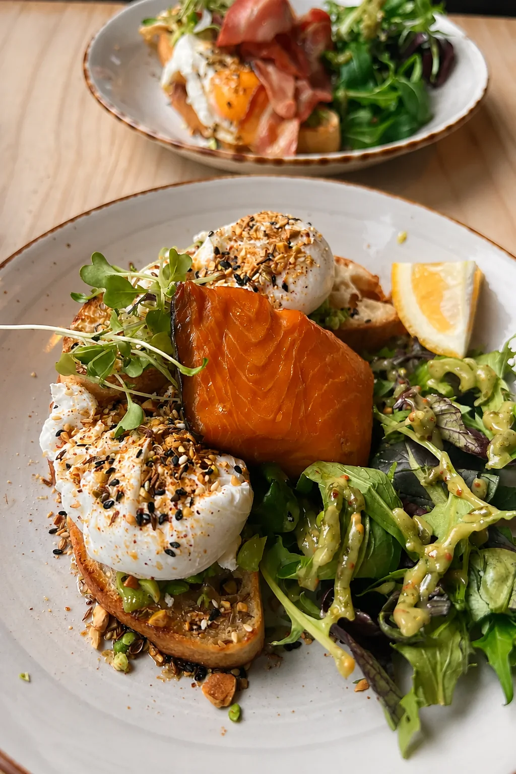 Salmon eggs benedict with eggs, greens and hollandaise